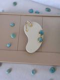 Par aretes ovalados larimar original laminado oro expositor